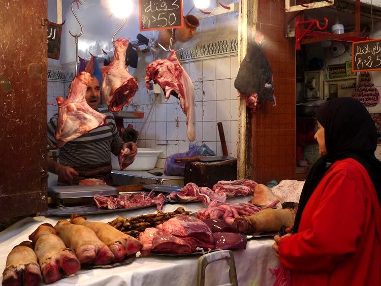 Camel Meat Market with an open table with camel hooves.