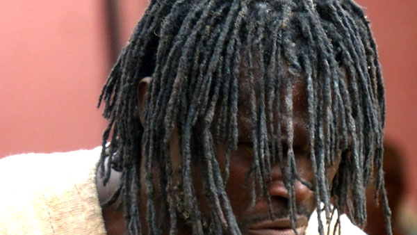 A close-up of the West African priest's dredlocks. 