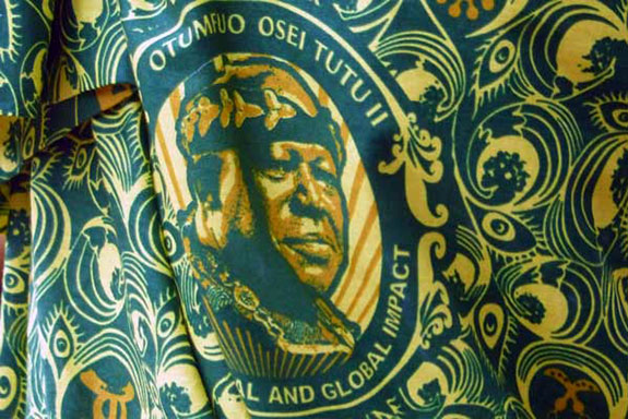 Green and gold tetile with face of king.