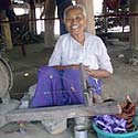 A traveler holding beautiful purple textiles