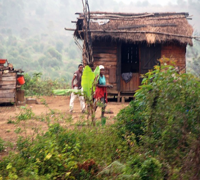 Indigenous family and their humble abode.