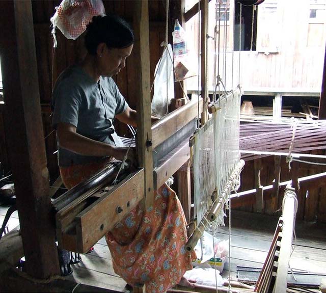 Burmese woman at a loom.