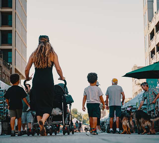 Family walking together on a city street