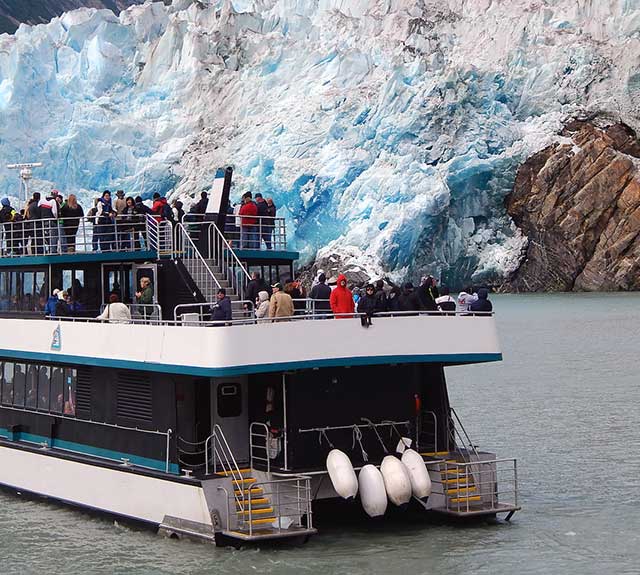 A ship full of passengers to view the Alaskan glaciers.
                      