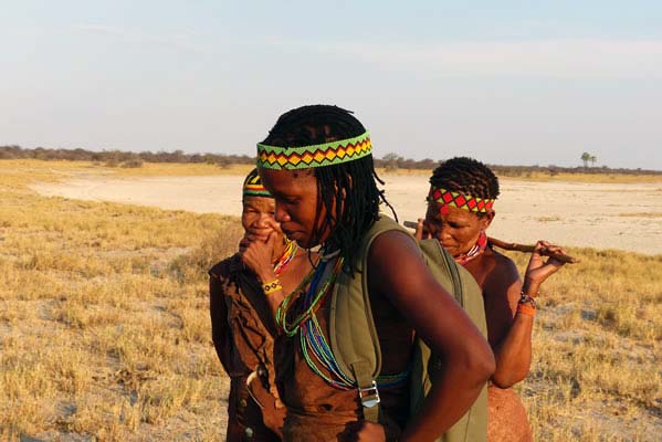 Three female tribal members in native dress.
                        