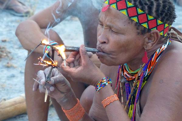 African trible member smoking.