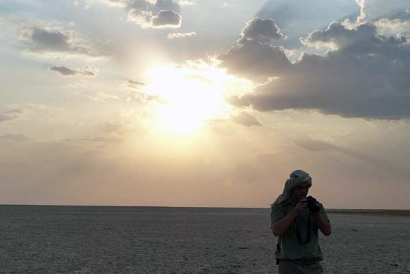 The gleaming sun shining behind one of the Safari travelers.