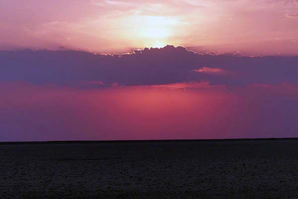 Red, purple, clouds in the sky.