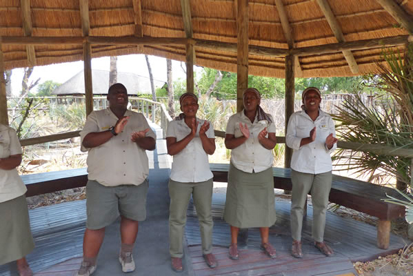 The Safari Camp staff welcoming its guests for dinner.