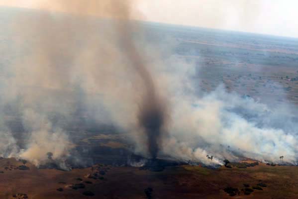 A tail of smoke emerges from the camp.