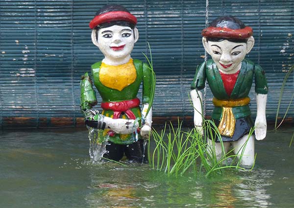 Closeup of a hand-painted wooden puppet in Hanoi.