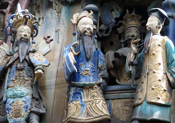 Close-up of 19th-century Cantoneses; Thien Hau Pagoda &statues. This pagoda was dedicated to the Goddess of the Sea.