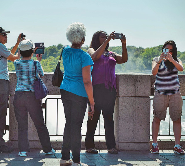 People Taking Pictures during Daytime
                                